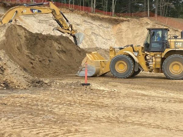 Bulldozer picking up dirt on construction site
